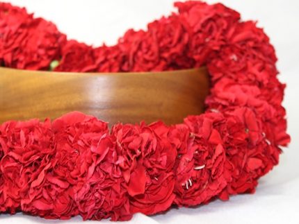 carnation leis in red