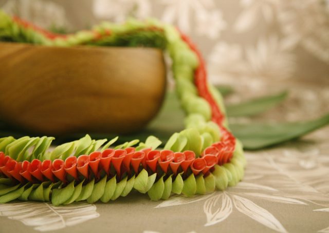 red and green orchid lei