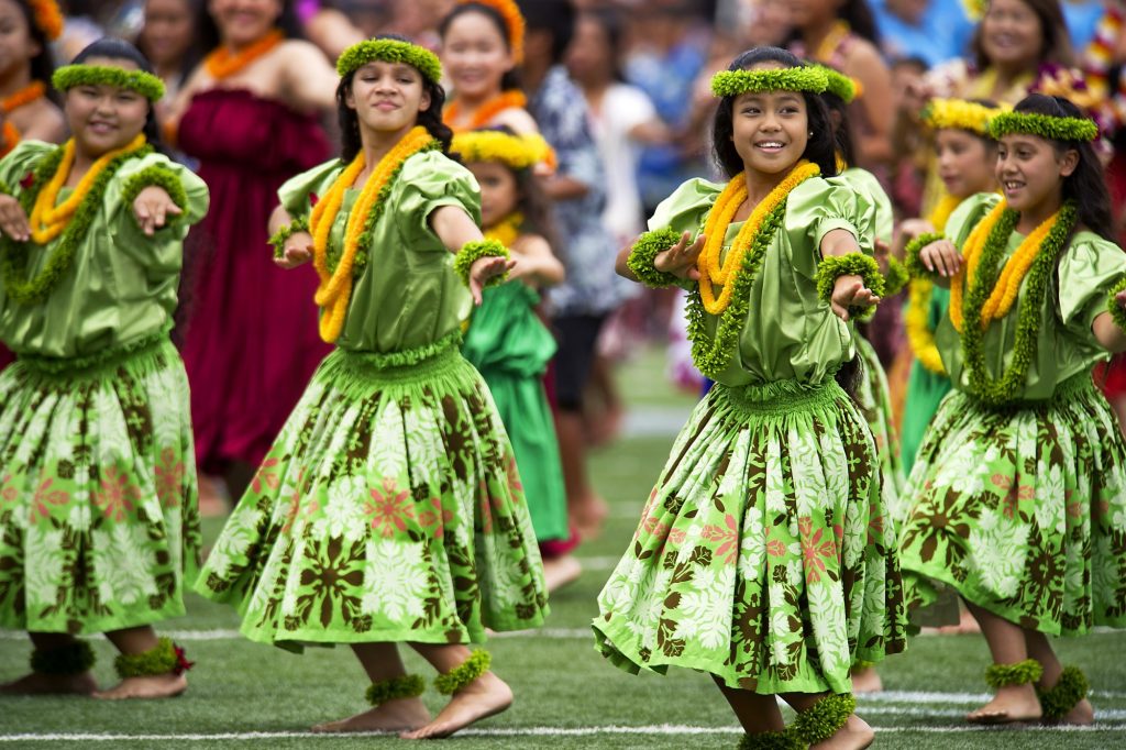 hula dancers with Hawaiian flowers leis